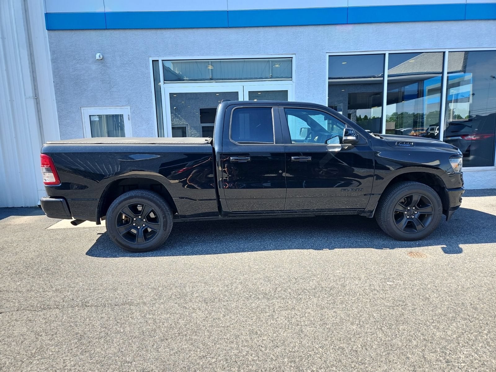 2021 RAM 1500 Big Horn in Black — front three-quarter view