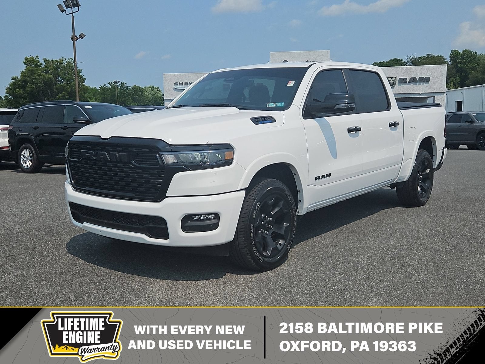 2025 RAM 1500 Big Horn in White — front three-quarter view