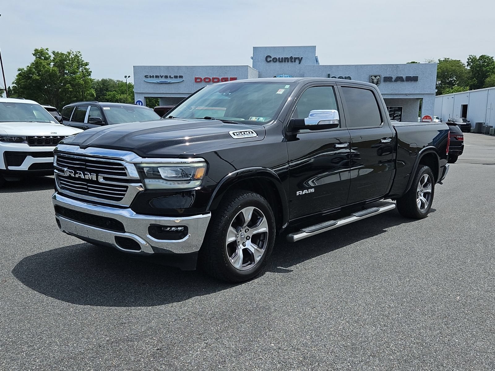 2022 RAM 1500 Laramie in Black — front three-quarter view