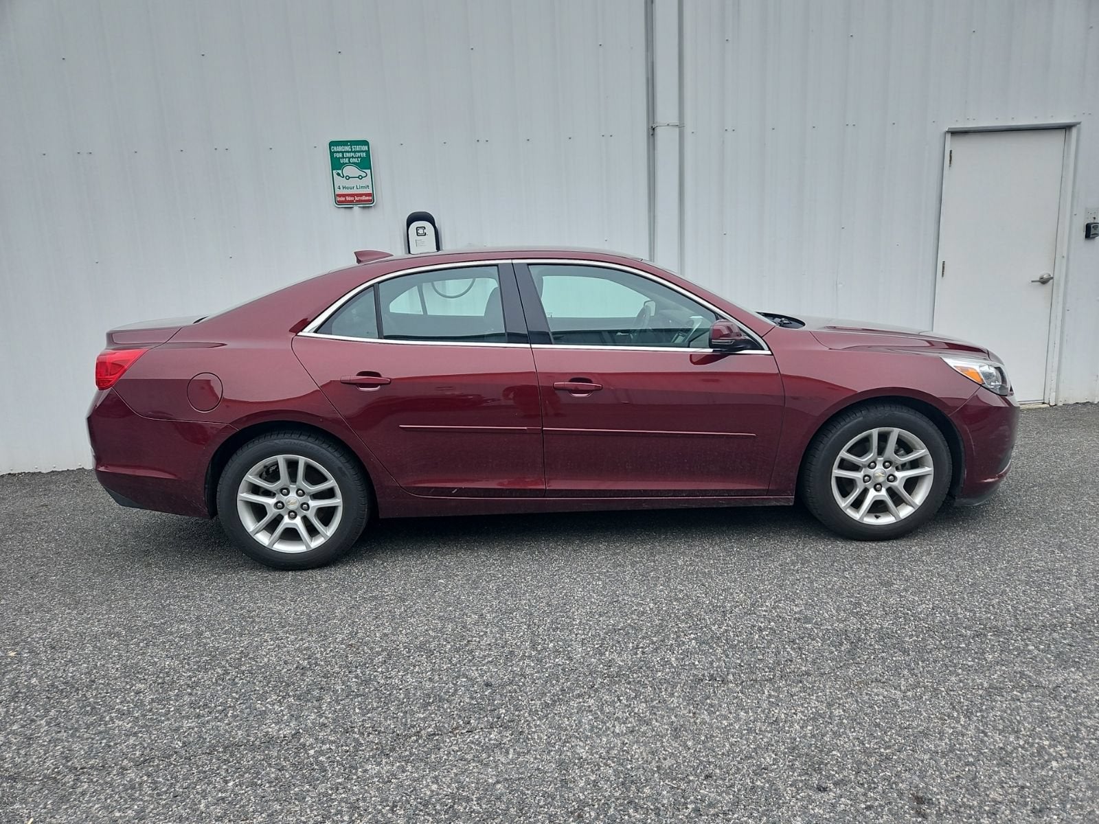 2015 Chevrolet Malibu LT in Butte Red Metallic — front three-quarter view