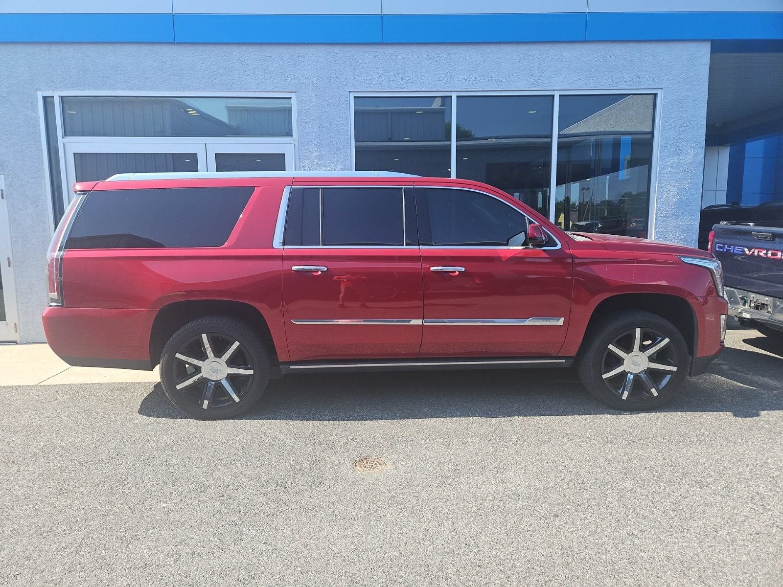 2015 Cadillac Escalade ESV Premium in Crystal Red Tintcoat — front three-quarter view